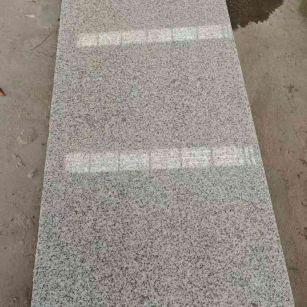 清远芝麻白光面毛板