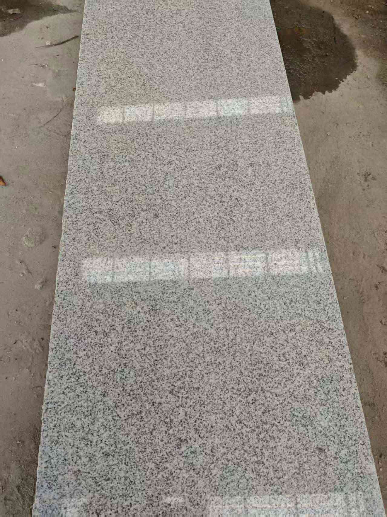 清远芝麻白光面毛板